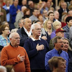 Those in attendance pledge allegiance during a Utah Republican caucus at Brighton High School in Salt Lake City on Tuesday, March 22, 2016.