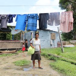 Ilisapeci Raiyaba works to dry clothes in the days after Tropical Cyclone Winston hit the Pacific island nation on Feb. 20.  Hundreds of people in Fiji lost homes during the Category 5 storm, the worst in the history of Fiji.