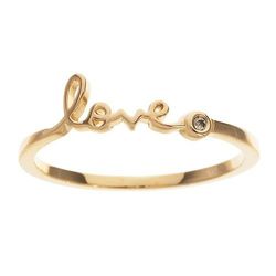 The Green Goddess Shy Jewelry collection has a gold "Love" ring, $125.