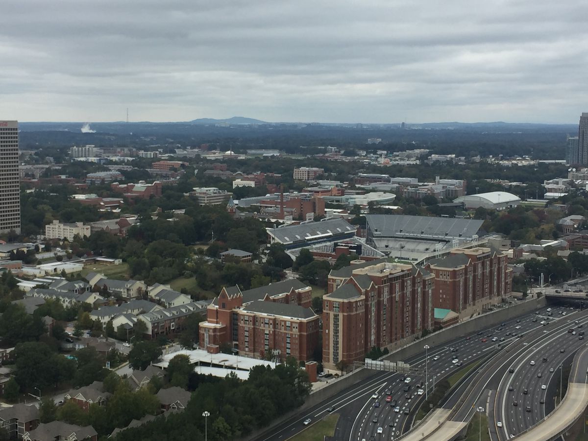 An aerial image showing Bobby Dodd Stadium and Georgia Tech dorms along the interstate.