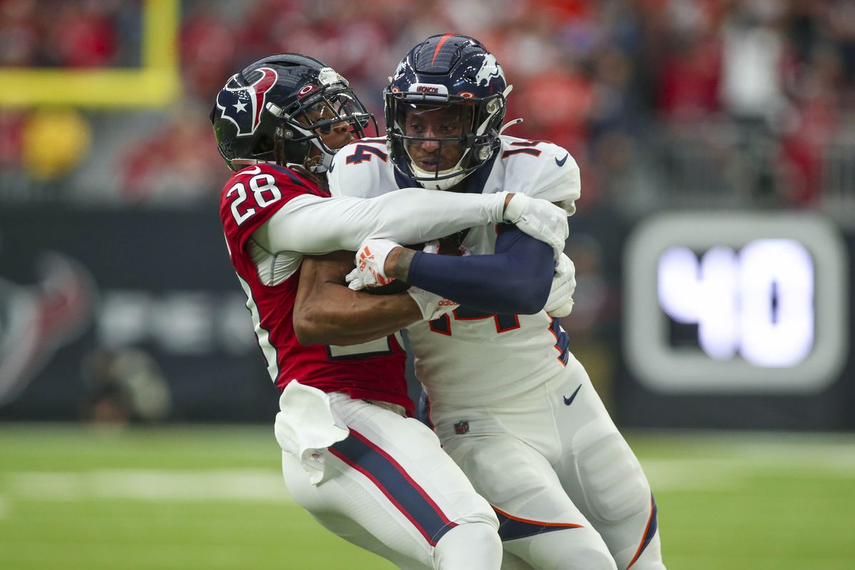 Houston Texans cornerback Vernon III Hargreaves tackles Denver Broncos wide receiver Courtland Sutton after a reception during the second quarter at NRG Stadium.