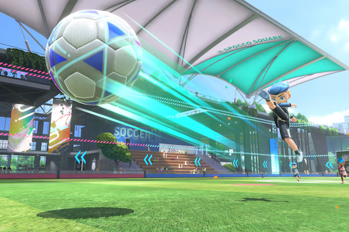 A character in Switch Sports kicks a soccer ball across the field