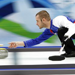 Jan Henri Ducroz of the French curling team delivers the stone during practice Monday at the Vancouver 2010 Olympics.