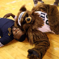 The Jazz Bear hangs out with Utah Jazz guard Shelving Mack, left, before an NBA regular season game against the Golden State Warriors at the Vivint Arena in Salt Lake City, Wednesday, March 30, 2016.