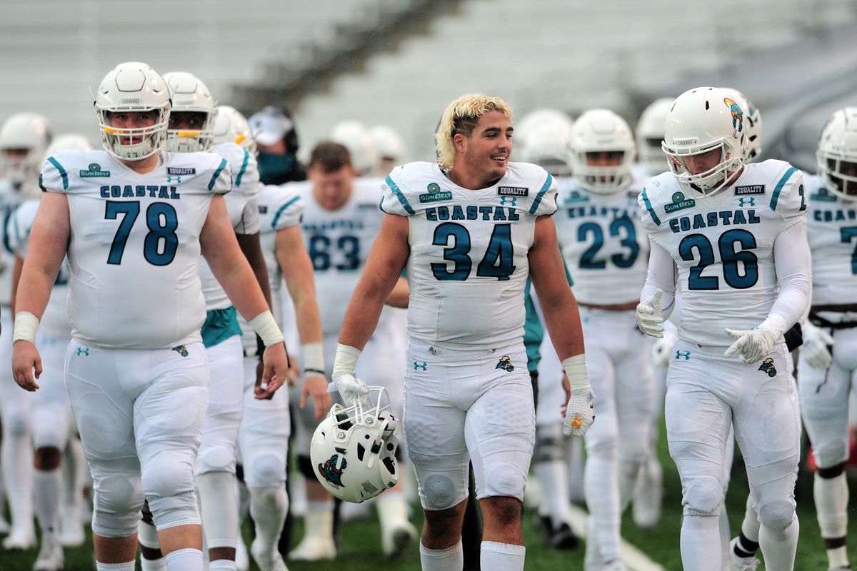 Coastal Carolina Chanticleers players Tyler Wagner, DE Tarron Jackson and Brayden Matts head toward the locker room at halftime during game featuring the Texas State Bobcats and the Coastal Carolina Chanticleers on November 28, 2020 at Bobcat Stadium in San Marcos, TX.