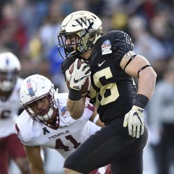 Wake Forest running back Cade Carney runs the ball against Temple during the first half of the Military Bowl NCAA college football game, Tuesday, Dec. 27, 2016 in Annapolis, Md. 