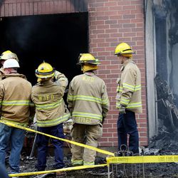 Crews work at a fire at condominium in West Jordan on Sunday, Aug. 6, 2017. West Jordan fire officials confirmed a woman in her 60s died in the fire at 1300 Winchester St. (6400 South).
