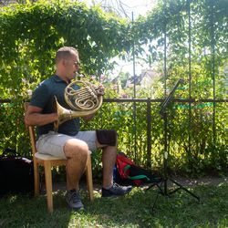 French horn player Jeremiah Frederick practices with the ’Rona Quartet.