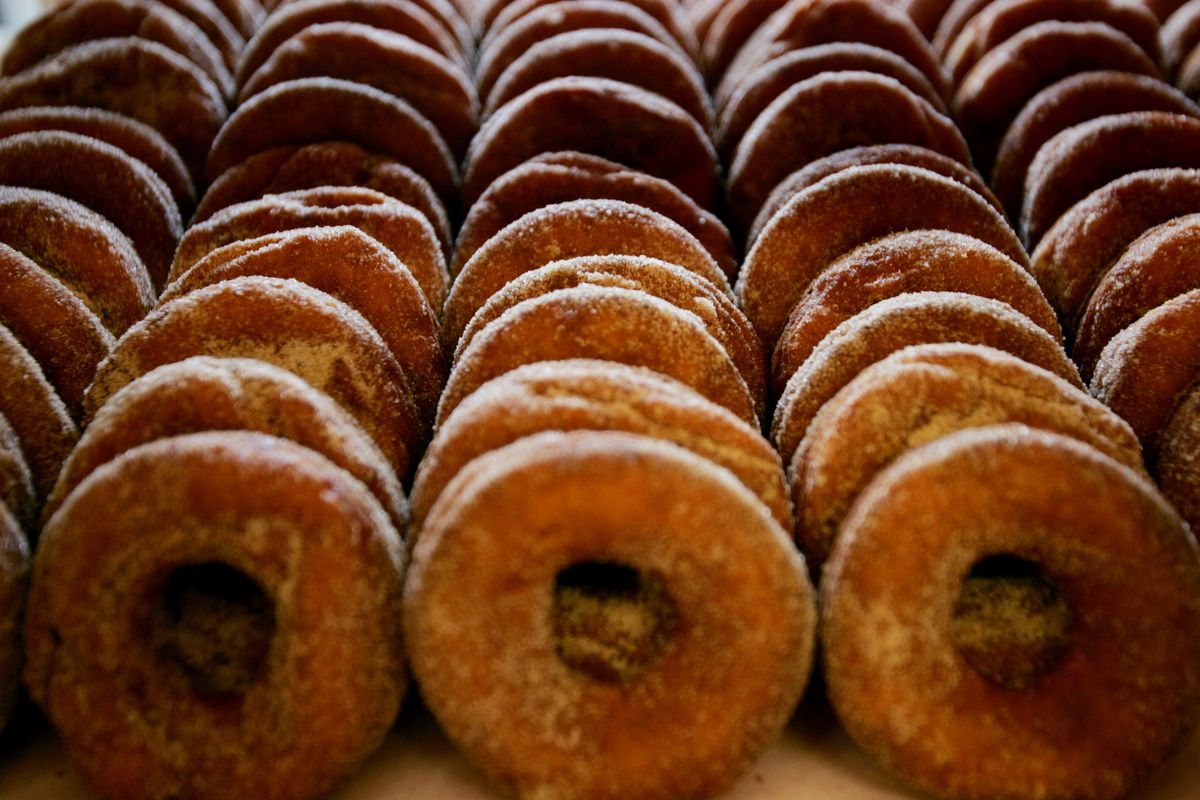 Rows of sugar-sprinkled cider donuts.