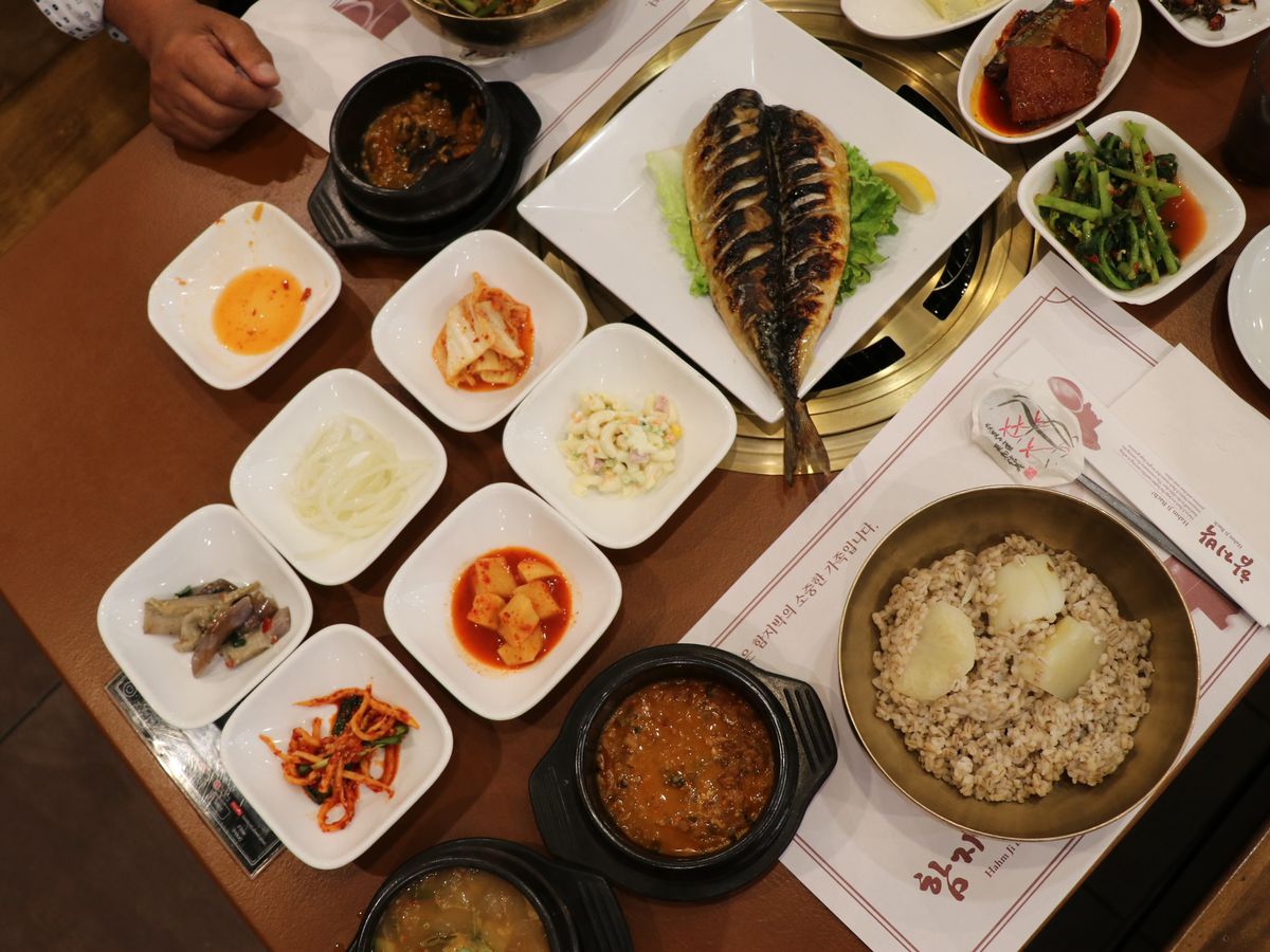 A collection of banchan and main dishes.