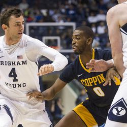 Brigham Young guard Nick Emery (4) sets up a pick on Coppin State guard Rasool Hinson (0) during an NCAA college basketball game in Provo on Thursday, Nov. 17, 2016.