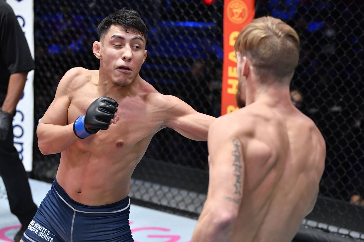 Fernie Garcia punches Joshua Weems in a bantamweight fight during Dana White’s Contender Series season 5 week 6 at UFC APEX on October 05, 2021 in Las Vegas, Nevada.