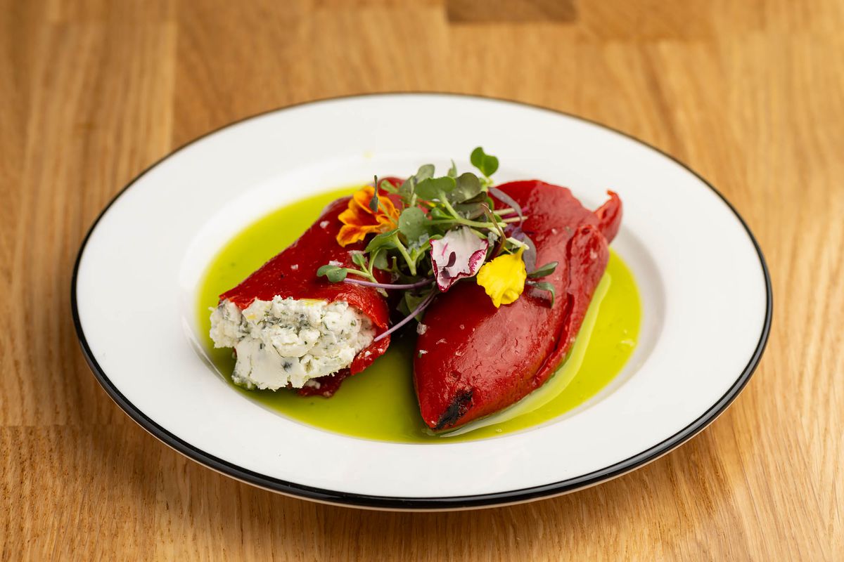 Piquillo peppers with goat cheese, herbs, and basil oil at Xuntos.