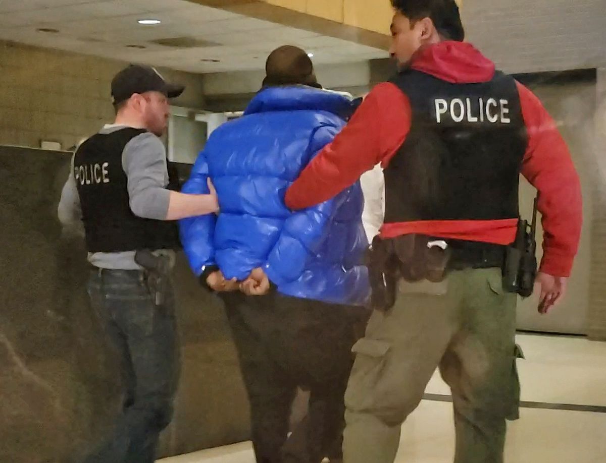 R. Kelly in custody at the Chicago Police Department’s Central District Friday night. | Nader Issa/Sun-Times