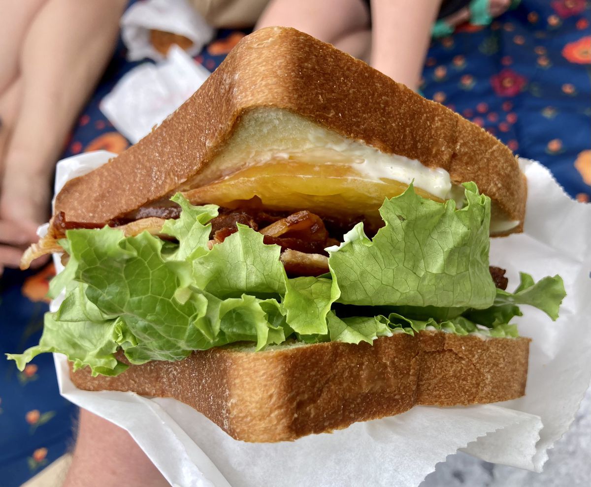 TGM Bread BLT with Duke’s mayo, yellow tomatoes, lettuce, bacon between two slices of thick white bread. 