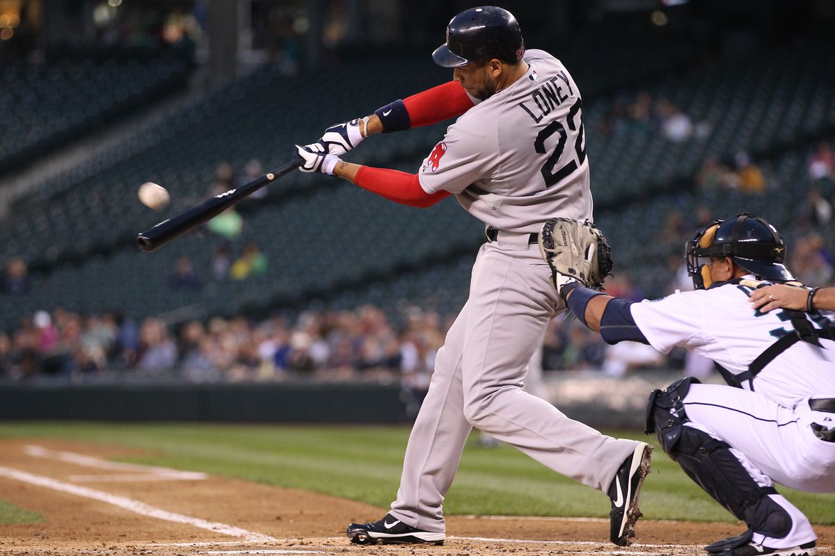 SEATTLE, WA:  James Loney #22 of the Boston Red Sox doubles against the Seattle Mariners at Safeco Field in Seattle, Washington.  (Photo by Otto Greule Jr/Getty Images)