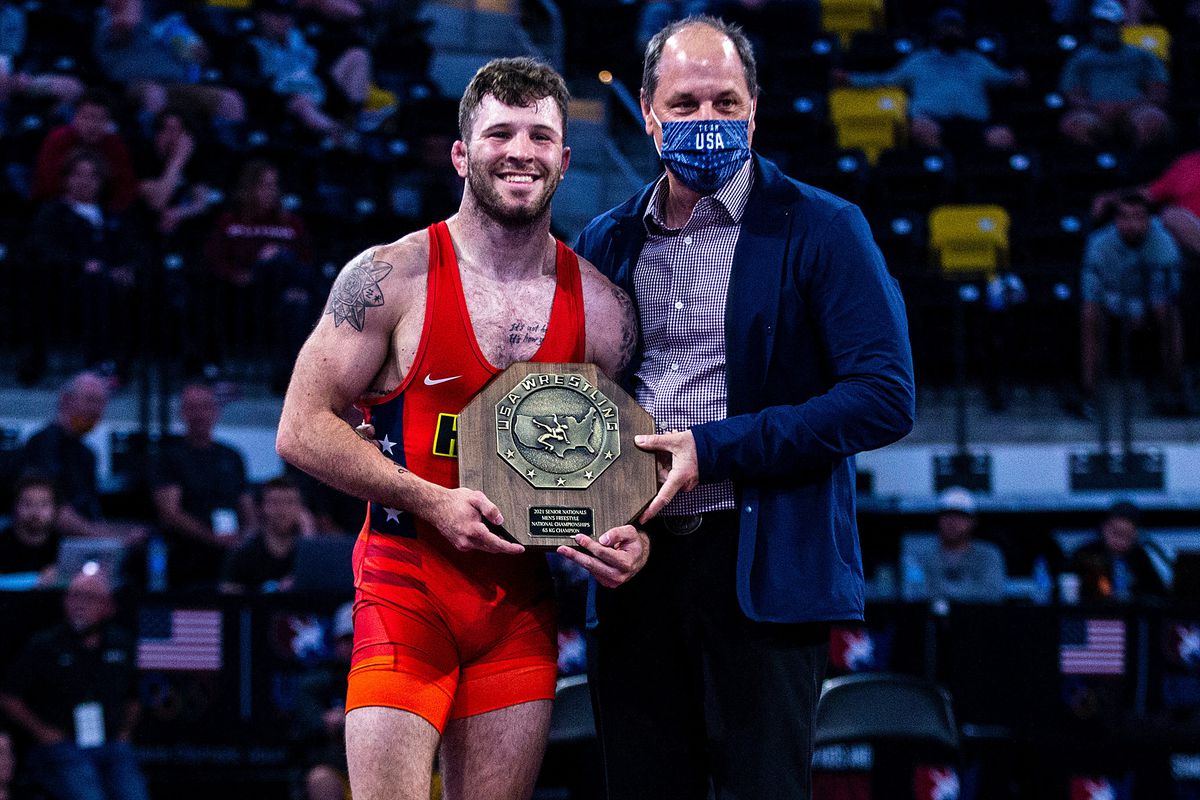 Jaydin Eierman is presented with his stop sign trophy after winning at 65 kg during the UWW Senior National freestyle wrestling championships,&nbsp;