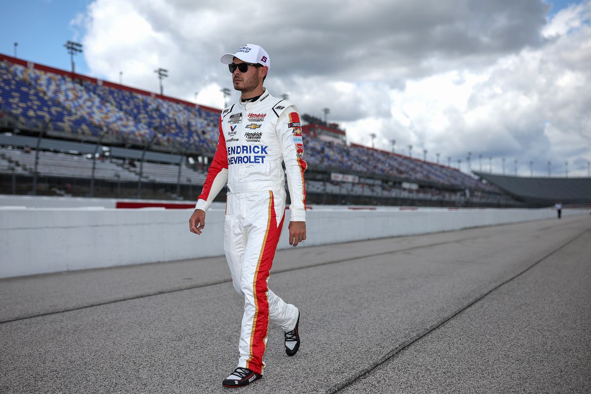 Kyle Larson, driver of the #5 Hendrickcars.com Chevrolet, walks the grid during qualifying for the NASCAR Cup Series Goodyear 400 at Darlington Raceway on May 07, 2022 in Darlington, South Carolina.
