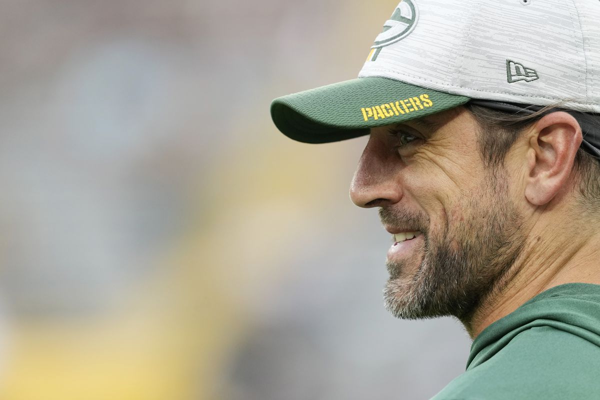 Aaron Rodgers #12 of the Green Bay Packers looks on before a preseason game against the New Orleans Saints at Lambeau Field on August 19, 2022 in Green Bay, Wisconsin.
