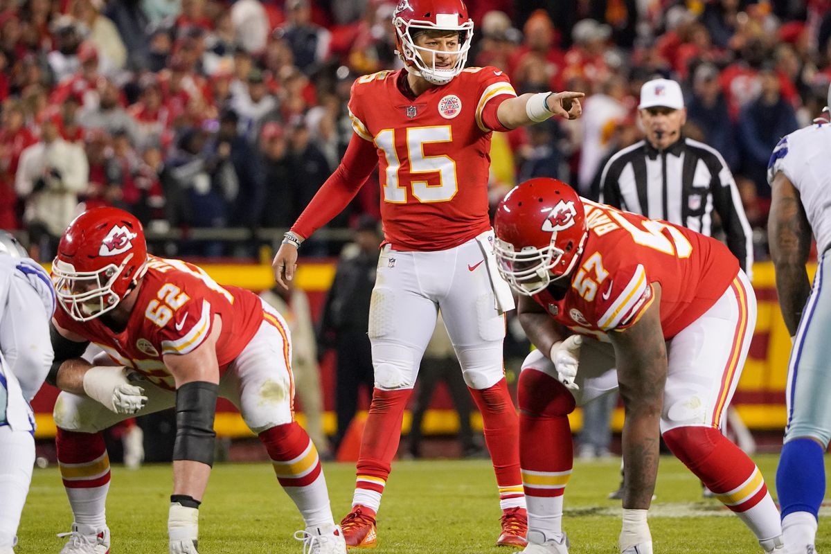 Kansas City Chiefs quarterback Patrick Mahomes (15) gestures on the line of scrimmage against the Dallas Cowboys during the second half at GEHA Field at Arrowhead Stadium.