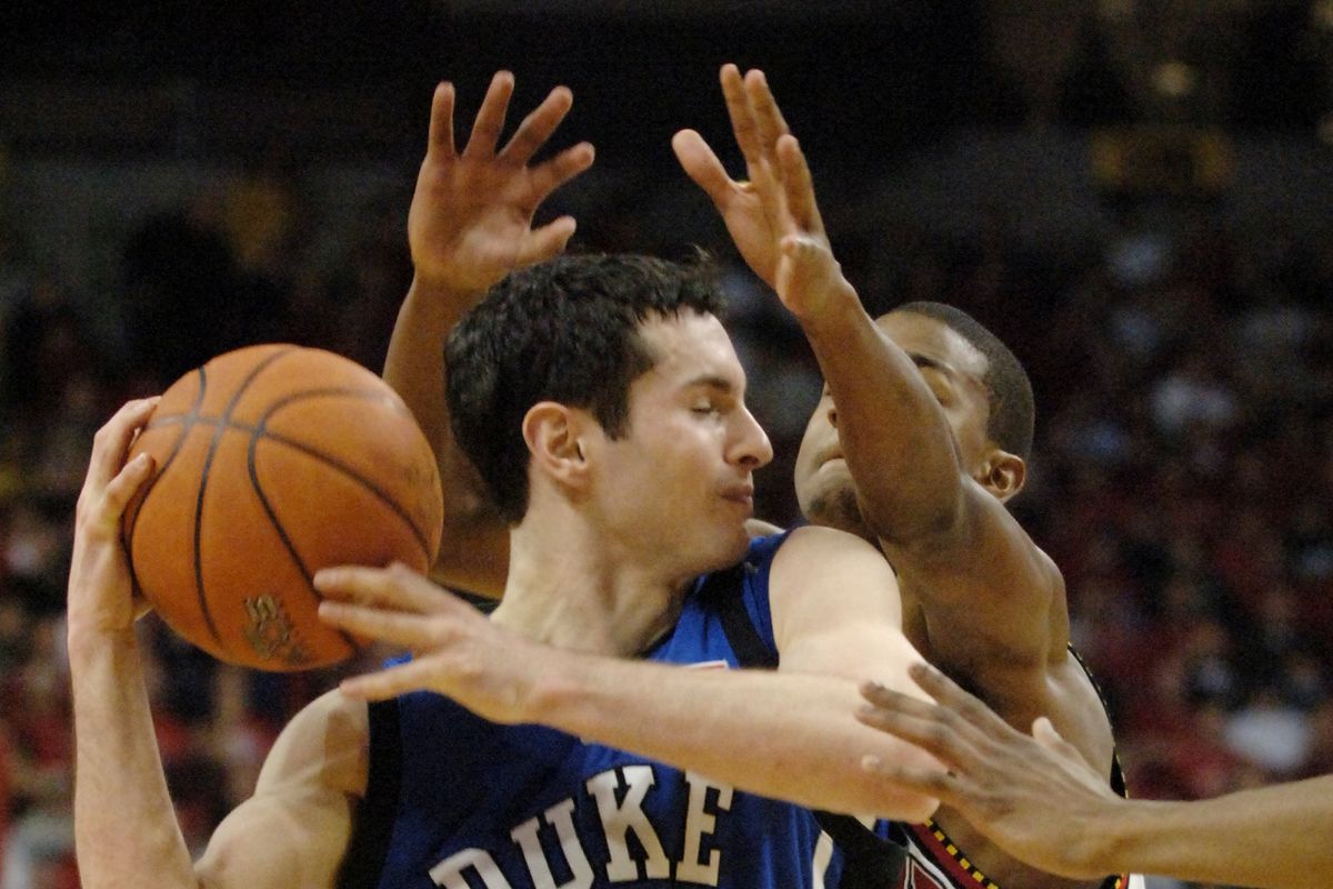 Duke’s J.J. Redick (4) is defended closely by Maryland’s D.J