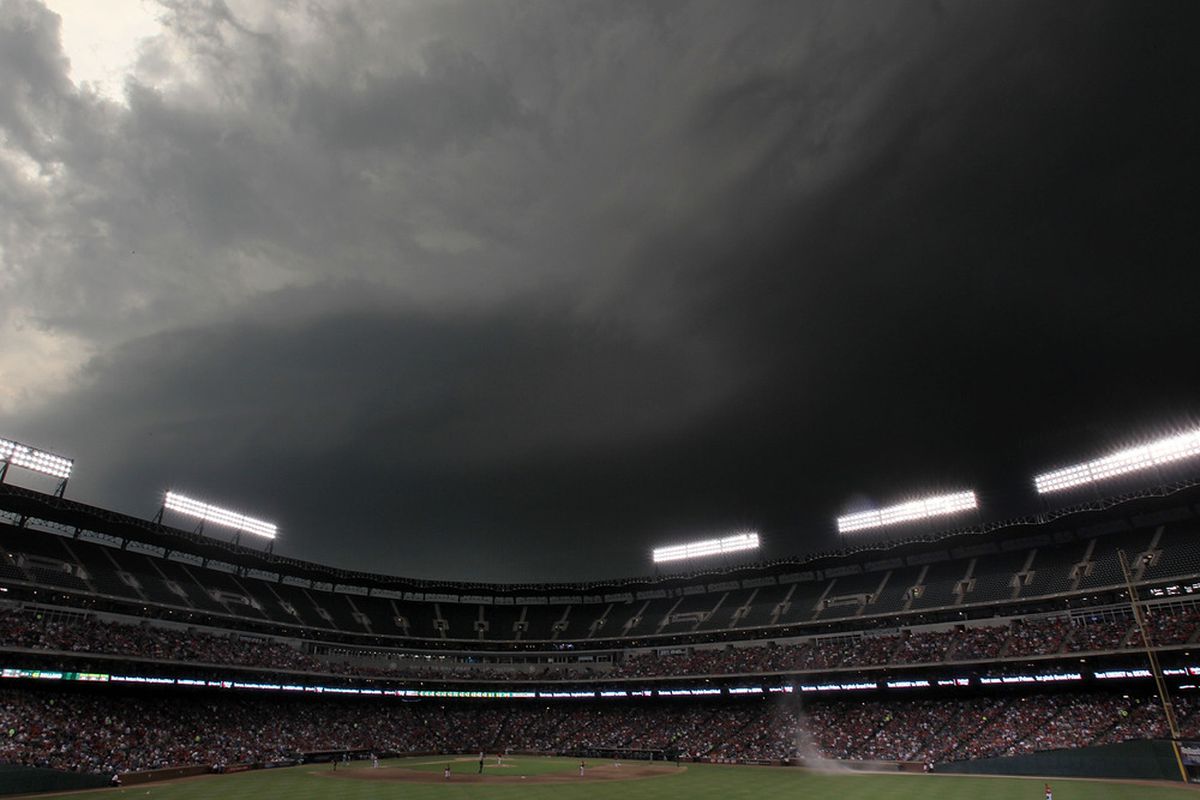 ARLINGTON, TX - MAY 24:  Heavy rain clouds form at Rangers Ballpark in Arlington during a game against the Chicago White Sox and the Texas Rangers on May 24, 2011 in Arlington, Texas.  (Photo by Ronald Martinez/Getty Images)