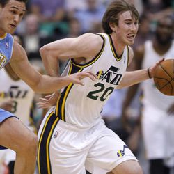 Utah's Gordon Hayward is fouled by Denver's Danilo Gallinari after a steal as the Utah Jazz and the Denver Nuggets play Wednesday, April 3, 2013 in Salt Lake City at EnergySolutions Arena. Denver beat the Jazz 113-96.