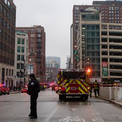 First responders at the scene of a fatal fire at a parking structure on Orleans and Hubbard, Saturday, Dec. 29, 2018, in Chicago. | Tyler LaRiviere/Sun-Times