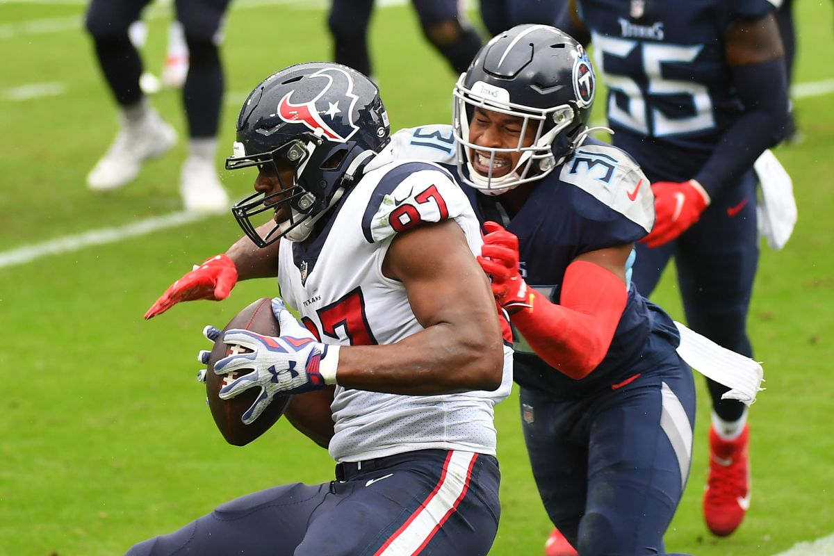 Houston Texans tight end Darren Fells (87) catches a touchdown pass in front of coverage from Tennessee Titans free safety Kevin Byard (31) during the second halfat Nissan Stadium.