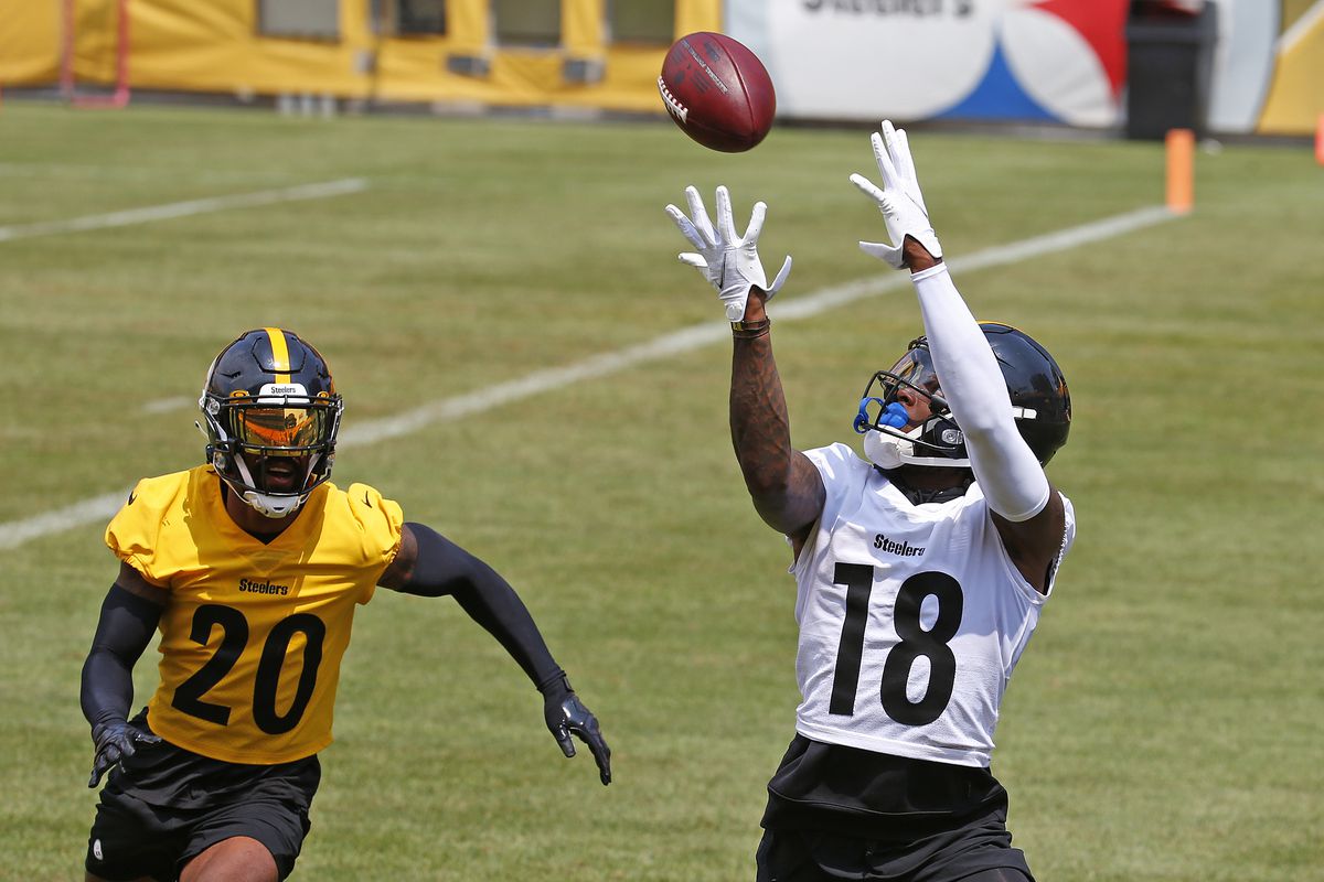 Diontae Johnson #18 of the Pittsburgh Steelers in action against Cameron Sutton #20 of the Pittsburgh Steelers during training camp at Heinz Field on July 29, 2021 in Pittsburgh, Pennsylvania.