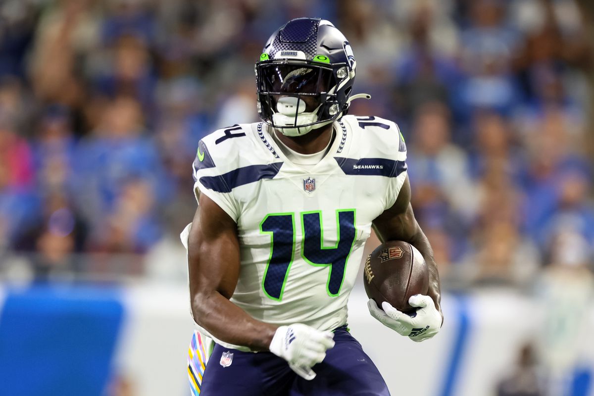 eattle Seahawks wide receiver DK Metcalf (14) carries the ball during an NFL football game between the Detroit Lions and the Seattle Seahawks