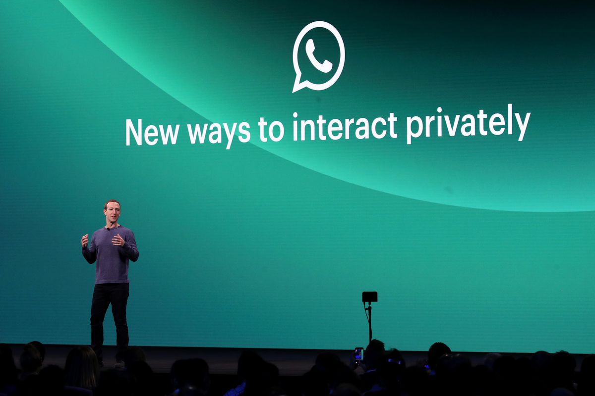 Facebook CEO Mark Zuckerberg at Facebook’s F8 developer conference standing onstage in front of a screen reading, “New ways to interact privately.”
