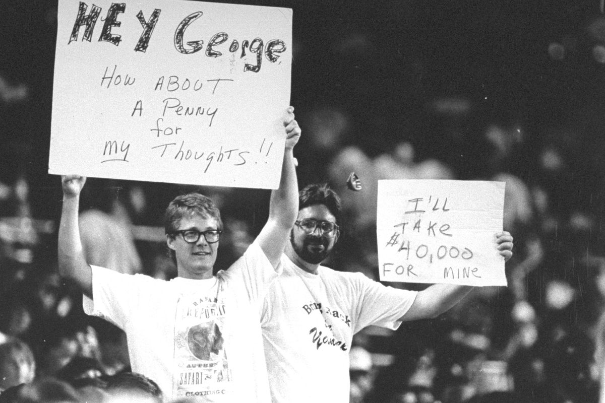 New York Yankees’ fans hold up anti-George Steinbrenner sign