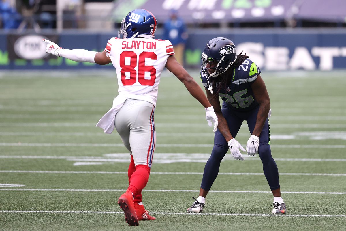 Darius Slayton #86 of the New York Giants and Shaquill Griffin #26 of the Seattle Seahawks line up for play in the second quarter at Lumen Field on December 06, 2020 in Seattle, Washington.