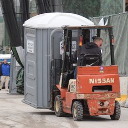 2:00 p.m. Portable restroom being removed from Gate K/J area - 