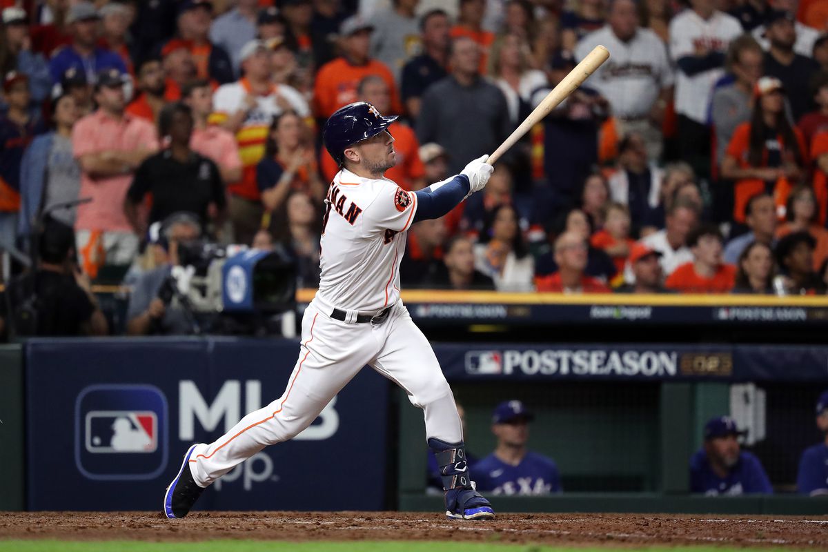 Alex Bregman of the Houston Astros flies out to Evan Carter of the Texas Rangers (not pictured) in the eighth inning during Game One of the American League Championship Series at Minute Maid Park on October 15, 2023 in Houston, Texas.