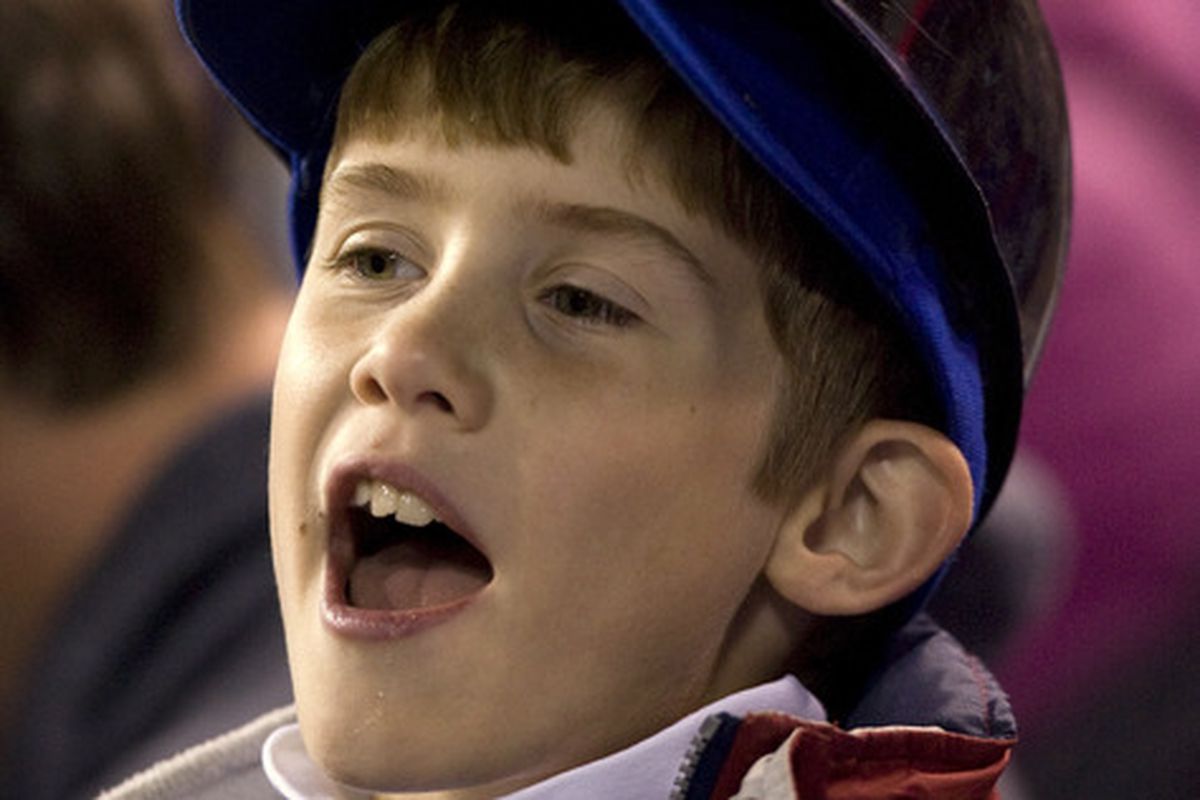 KANSAS CITY, MO - SEPTEMBER 16:   A young Kansas City Royals fan cheers during a game against the Chicago White Sox in the fifth inning at Kauffman Stadium on September 16, 2011 in Kansas City, Missouri. (Photo by Ed Zurga/Getty Images)