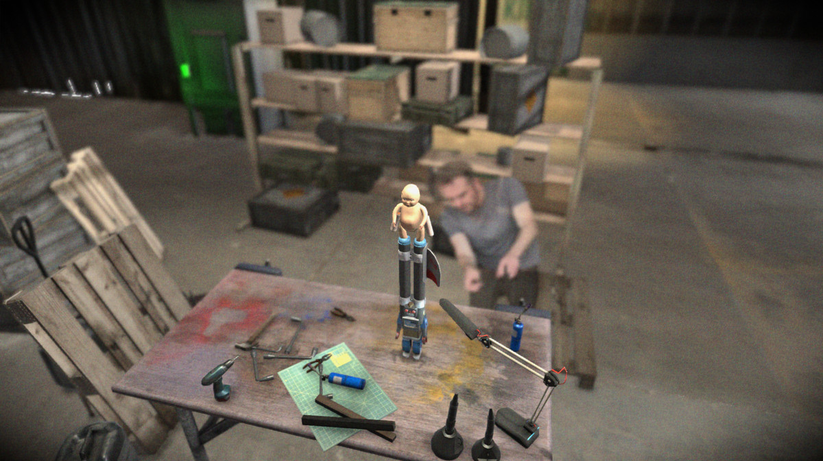 A blurry photograph of an amateur engineer flits around a 3D model of a homebrew rocket with a baby on top.