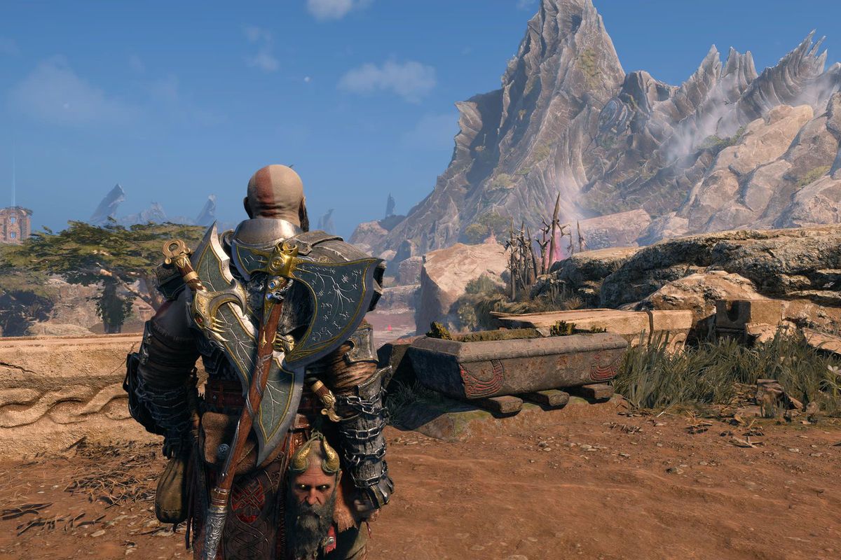 Kratos looks at a mountain in Vanaheim while wearing the Steinbjorn armor in God of War Ragnarok.