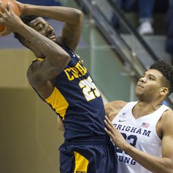 Coppin State forward Terry Harris Jr. (25) comes down with a rebound over Brigham Young forward Yoeli Childs (23) during an NCAA college basketball game in Provo on Thursday, Nov. 17, 2016.
