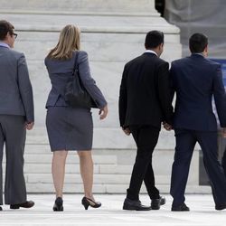 California's Proposition 8 plaintiffs, from left, Kris Perry, Sandy Stier, Paul Katami, and Jeff Zarrillo walk into the Supreme Court in Washington, Monday, June 24, 2013.