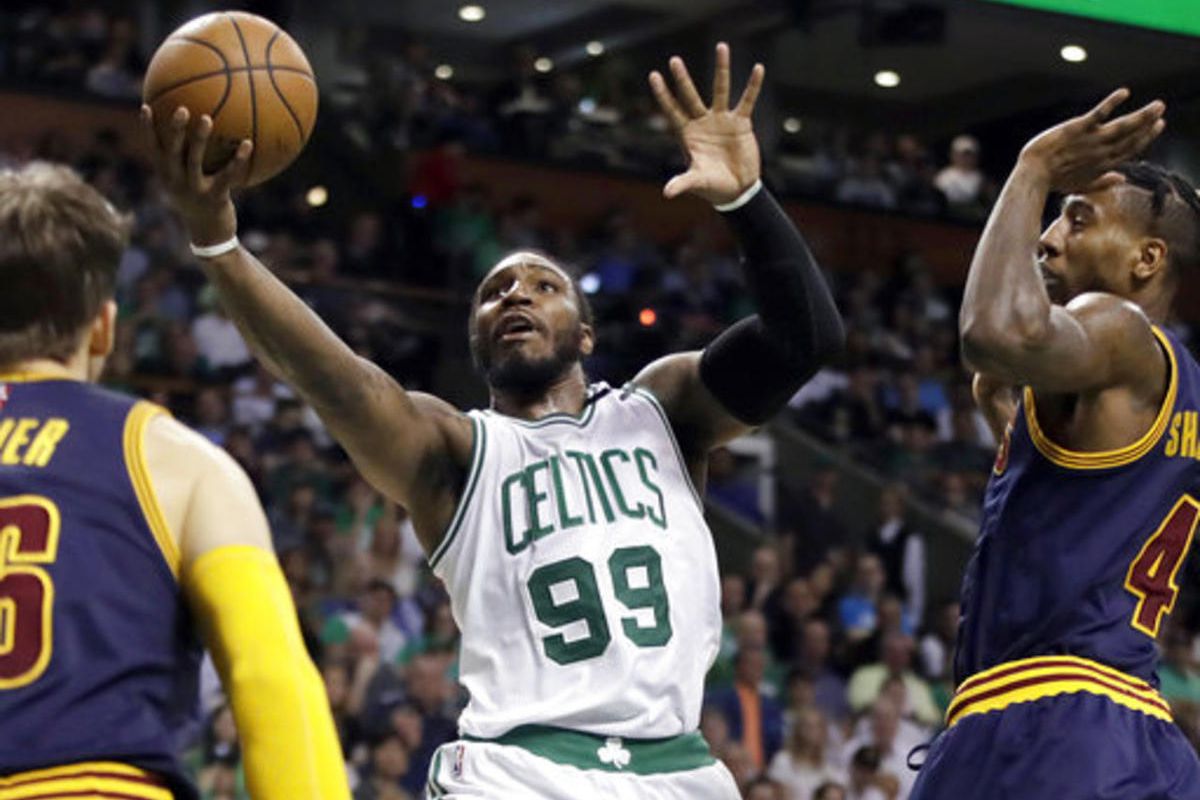 Boston Celtics forward Jae Crowder (99) drives between Cleveland Cavaliers guards Kyle Korver, left, and Iman Shumpert, right, during first half of Game 2 of the NBA basketball Eastern Conference finals, Friday, May 19, 2017, in Boston.