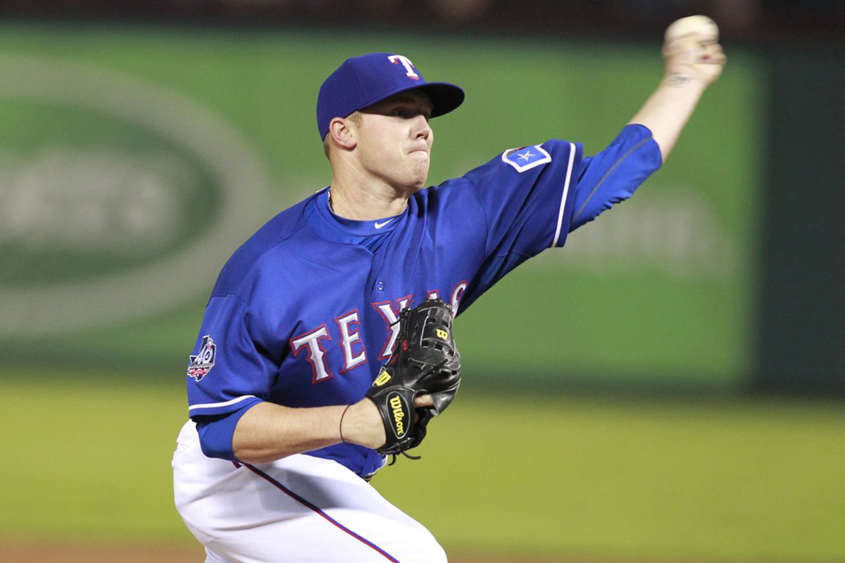 Apr 8, 2012; Arlington, TX, USA; Texas Rangers pitcher Robbie Ross (46) pitches in the 8th inning against the Chicago White Sox at Rangers Ballpark. The Rangers beat the White Sox 5-0. Mandatory Credit: Tim Heitman-US PRESSWIRE