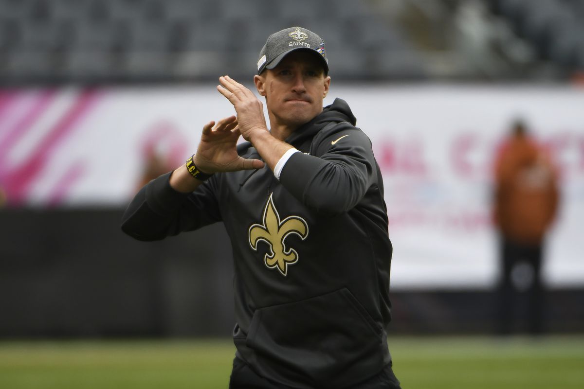 Drew Brees of the New Orleans Saints warms up before the game against the Chicago Bears at Soldier Field on October 20, 2019 in Chicago, Illinois.