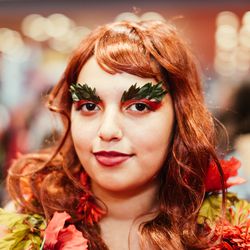 Poison Ivy: Cover the lid in red eyeshadow, then use eyelash glue to attach silk leaves to the brows. Line the lips in a deep burgundy, then blend.