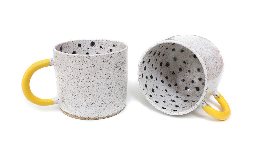 Mugs with yellow handles and polka-dot insides