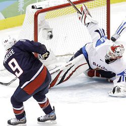 USA's Zach Parise (9) scores a goal against Finland's goalie Miikka Kiprusoff in the first period of a men's semifinal round ice hockey game at the Vancouver 2010 Olympics in Vancouver, British Columbia, Friday.