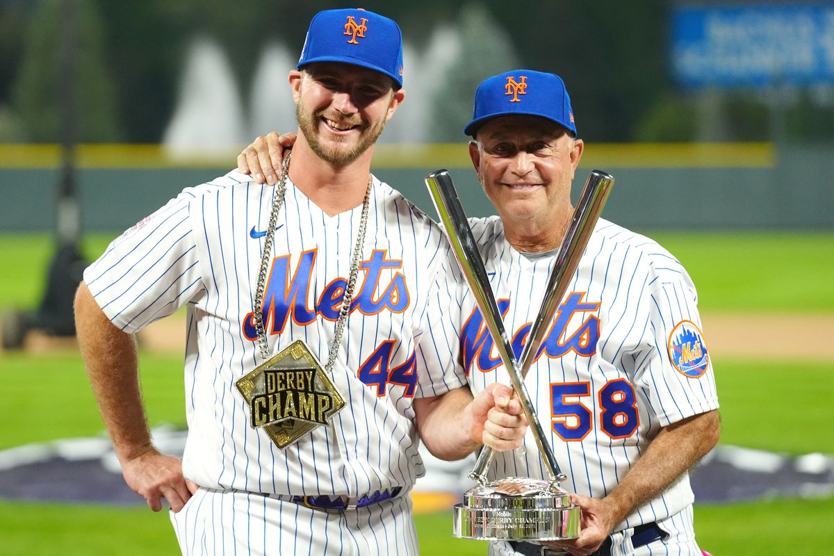 Pete Alonso #20 of the New York Mets celebrates winning his second straight home run derby title with Mets Bench Coach Dave Jauss #58 during the 2021 T-Mobile Home Run Derby at Coors Field on Monday, July 12, 2021 in Denver, Colorado.