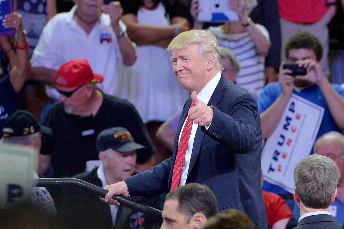 Donald Trump makes a thumbs-up gesture during a campaign rally in Wilmington, N.C.
