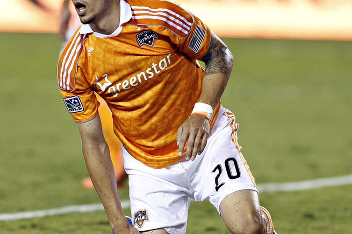 HOUSTON - MAY 15: Geoff Cameron #20 of the Houston Dynamo comes up short on a goal opportunity against the Portland Timbers at BBVA Compass Stadium on May 15, 2012 in Houston, Texas. (Photo by Bob Levey/Getty Images)